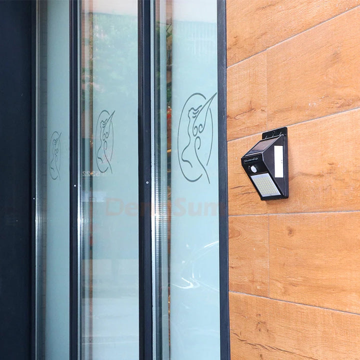 PIR Motion Sensor 100LED Sunlight control 3 sided Solar Energy Street light Yard Path Home Garden Solar Power lamp Wall Light